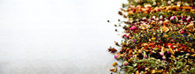 Tea Background: Green, Black, Floral, Herbal, Mint, Melissa, Ginger, Apple, Rose, Lime Tree, Fruits, Orange, Hibiscus, Raspberry, Cornflower, Cranberry. Assortment Of Dry Tea, Top View. Banner