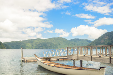 Naklejka na meble Wooden boat pier on mountain lake