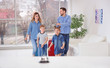 © New Africa - Happy family arriving in hotel