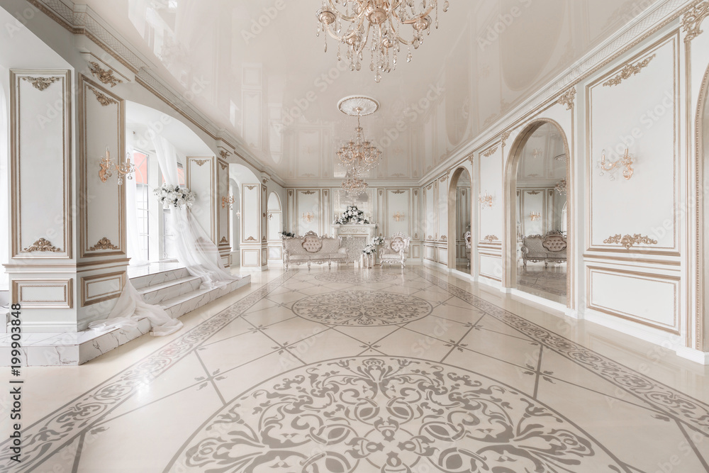 Luxurious vintage interior with fireplace in the aristocratic style. Large Windows and mirrors. Columns and arches, ornament on the glossy floor - obrazy, fototapety, plakaty 