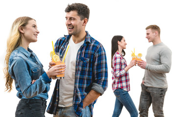 The two couples clink glasses on a white background