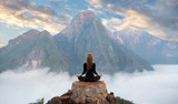 Fototapeta Zachód słońca - Serenity and yoga practicing,meditation at mountain range