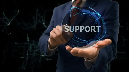 Businessman shows concept hologram Support on his hand. Man in business suit with future technology screen and modern cosmic background