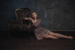 © artyme - Dramatic studio portrait of a beautiful dreamy girl. Soft vintage toning.