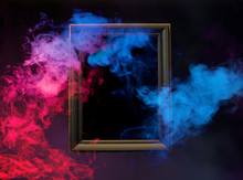 Abstract Colorful Smoke From Wooden Frame On Dark Background