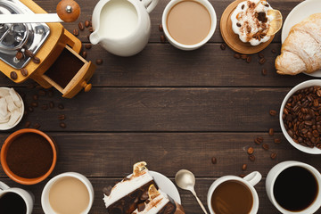 Various coffee cups and sweet pastry on vintage wooden table, to