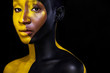 © Mike Orlov - Black and yellow makeup. Cheerful young african woman with art fashion makeup.