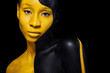 © Mike Orlov - Black and yellow makeup. Cheerful young african woman with art fashion makeup.