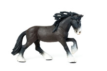 Figurine Of A Black Horse Jumps, On A White Background.