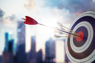 arrow hit the center of target with modern skyscraper background. business target achievement concep
