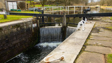 Water Flowing Over A Closed Canal Lock Gate.