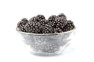 Wall Mural - Ripe BlackBerry berries in a glass bowl.