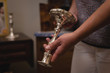 © Wavebreak Media - Woman holding an antique piece