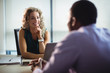 © Wavebreak Media - Business executives interacting with each other