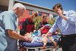 © Wavebreak Media - Paramedics examining injured boy