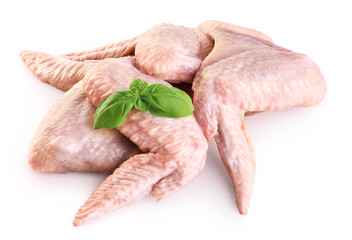 Wall Mural - Raw chicken wings and basil isolated on white background.