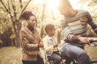 © Mladen - Happy African American Father driving daughter on bike.