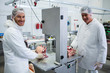 © Wavebreak Media - Butchers cutting raw meat on a band saw machine