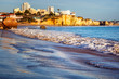 Portimao, city on the Atlantic coast at sunset, red cliffs and sandy beach, Beautiful seascape, Algarve, Portugal