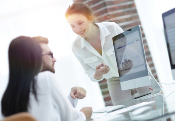 Wall Mural - specialists of the company discussing financial schedules at the desk