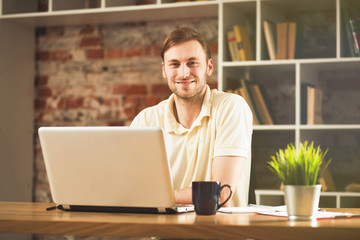 Canvas Print - Young man with a laptop