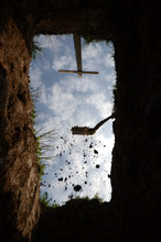 View Upwards From The Botom Of A Grave, A Last Glimpse Of The Sky. The Gravedigger Has Begun Covering The Grave.