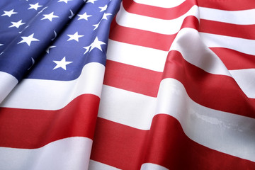 Close up of ruffled American flag. Patriots day, memorial weekend, veterans day, presidents day, independence day background. United States of America national stars and stripes symbol. Copy space.