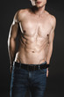© Yakobchuk Olena - Demure male stripped to waist. He isolated on dark background