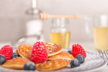 Canvas Print - mini pancakes with fruit and honey