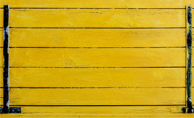 Beautiful Yellow wood wall background. Old horizontal planks with bright yellow paint.