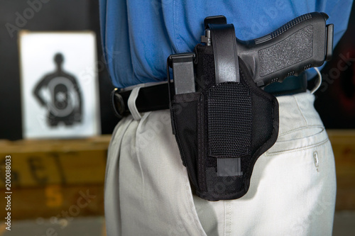 Fotografía Man wearing a handgun in a webbing holster