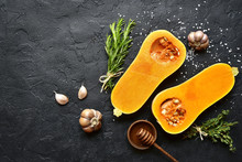Halves Of Raw Organic Butternut Squash With Spices And Ingredients For Making.Top View With Copy Space.
