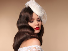 Elegant Bride Woman Portrait In Retro Hat. Retro Lady With Wavy Hairstyle And Red Lips Makeup. Brunette Female Isolated Beige Background.