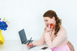 © LIGHTFIELD STUDIOS - beautiful woman writing something to notebook and holding apple at kitchen