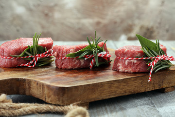 Raw beef fillet steaks with spices for bbq grilling.