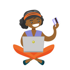 Sticker - African-american woman sitting on the floor with a laptop computer and holding credit card in hand. Woman buying things online. Vector cartoon illustration isolated on white background. Square layout.