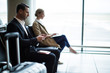 © Wavebreak Media - Businessman using mobile phone in waiting area