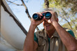 © Wavebreak Media - Mature man looking through binocular