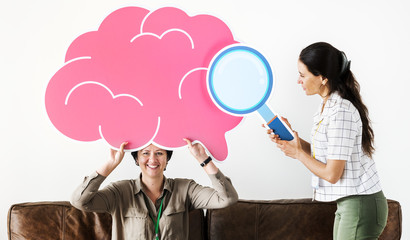 Wall Mural - Women holding pink cloud icons