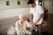 © Wavebreak Media - Nurse helping senior man to stand up