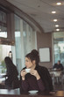 © Wavebreak Media - Thoughtful female executive having coffee in cafeteria