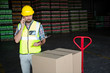 © Wavebreak Media - Young male worker talking on phone in factory