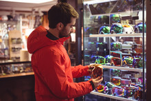 Man Shopping In A Goggles Shop