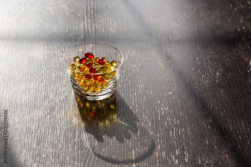 Fotografie, Obraz Cod liver oil, food supplement, fish oil capsules for everyday healthy nutrition and life energy