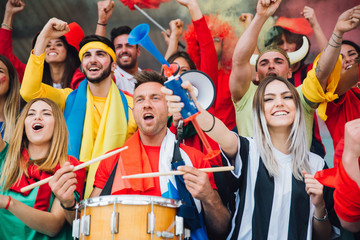 Wall Mural - Football fans supporting their team at the arena for the world championship,