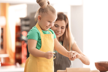 Canvas Print - Mother with daughter together in kitchen