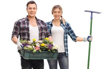 Poster - Male gardener with a rack of flowers and a female gardener with a rake