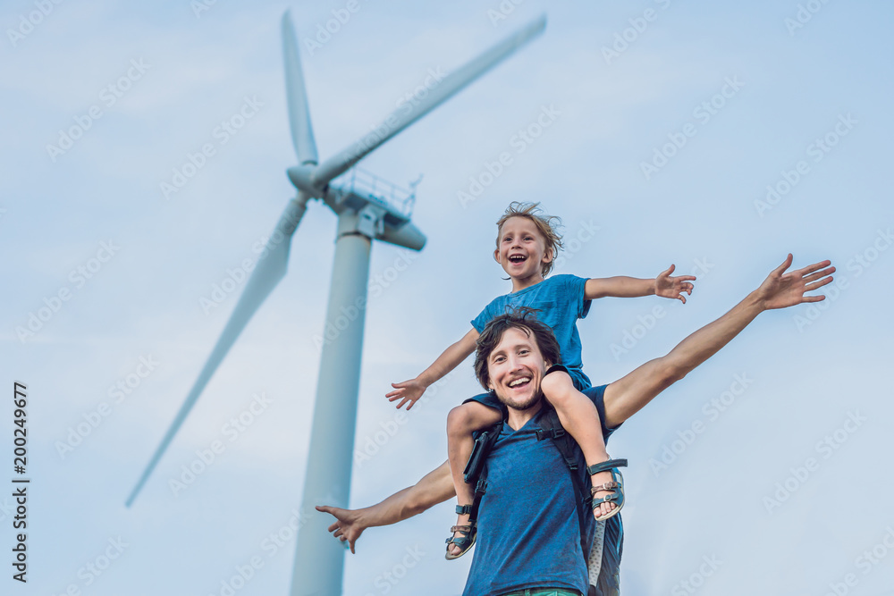 Father carrying son on shoulders and waving their arms like a windmill - obrazy, fototapety, plakaty 