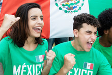 Young Soccer Fans From Mexico With Mexican Flag