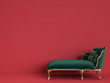 Classic chaise longue in emerald green and gold on red background with copy space